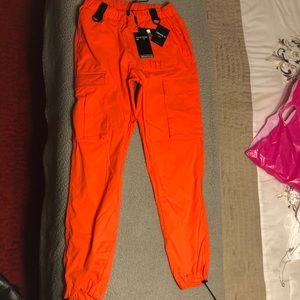 NEVER WORN. Neon orange pants. Size XL
